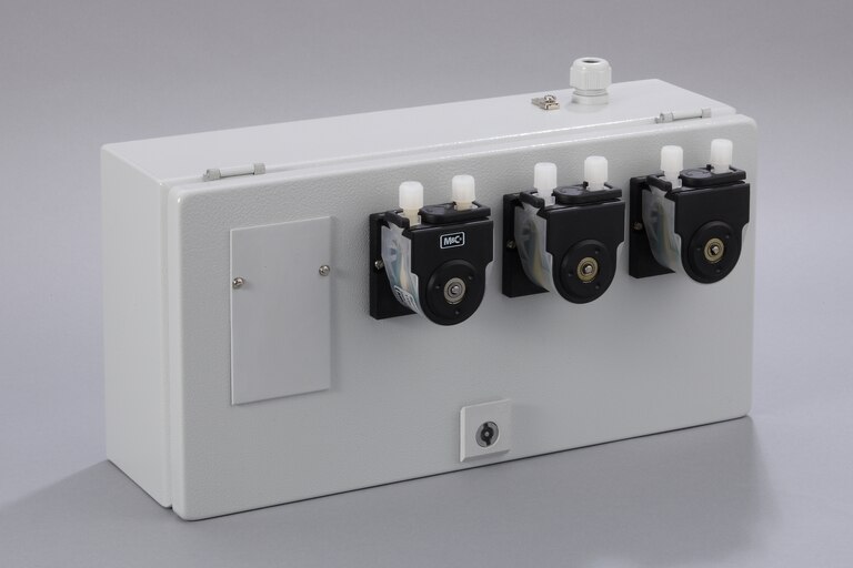 Oblique view of 3 Peristaltic Pumps SR25.1/Ex-G in a stainless steel enclosure